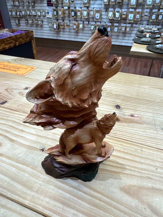 Wooden wolf head statue